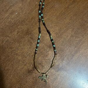 Vintage fairy beaded handmade necklace 
In gold with small green gem